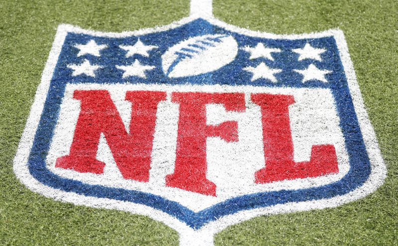 © Reuters. FILE PHOTO: Aug 1, 2024; Canton, Ohio, USA; General view of the NFL shield logo on the field at the Tom Benson Hall of Fame Stadium site of the Professional Football Hall of Fame game and induction ceremonies. Mandatory Credit: Charles LeClaire-USA TODAY Sports/FIle Photo