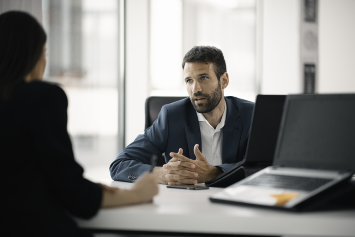 An investor meeting with a financial advisor to discuss his investment portfolio.
