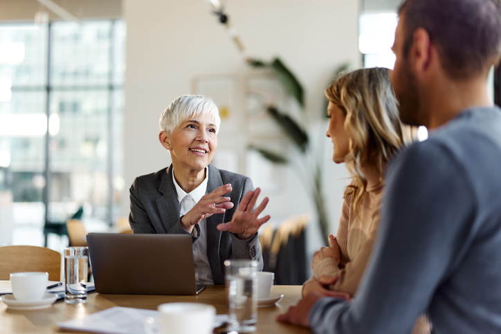 A financial advisor helping real estate investors create a financial plan.