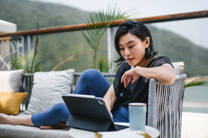 A young woman reviews the variable expense ratio formula and what it means for her investment portfolio.