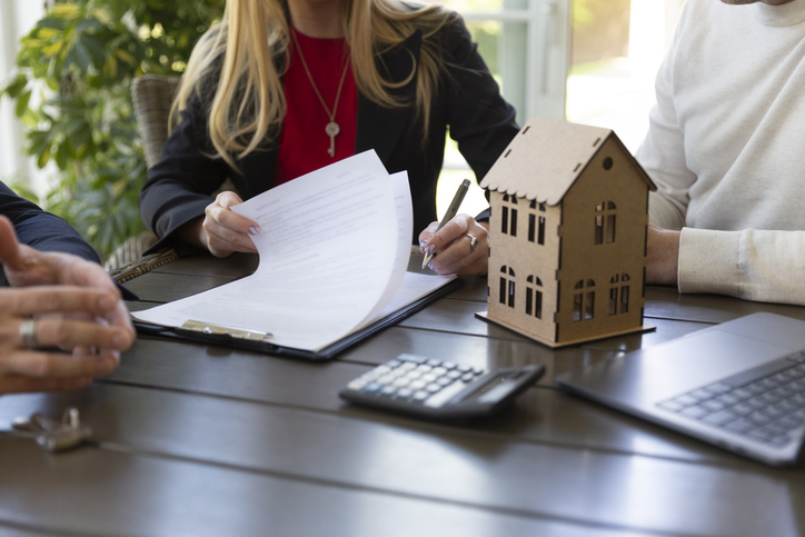 Investors closing on a real estate investment.