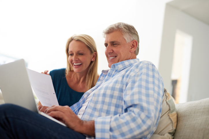 A senior couple reviewing their I Bond investments.